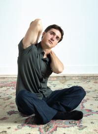 Felipe De Oliveira practices a Self-Breema exercise